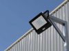 LED flood light mounted on a metal wall