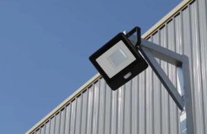 LED flood light mounted on a metal wall