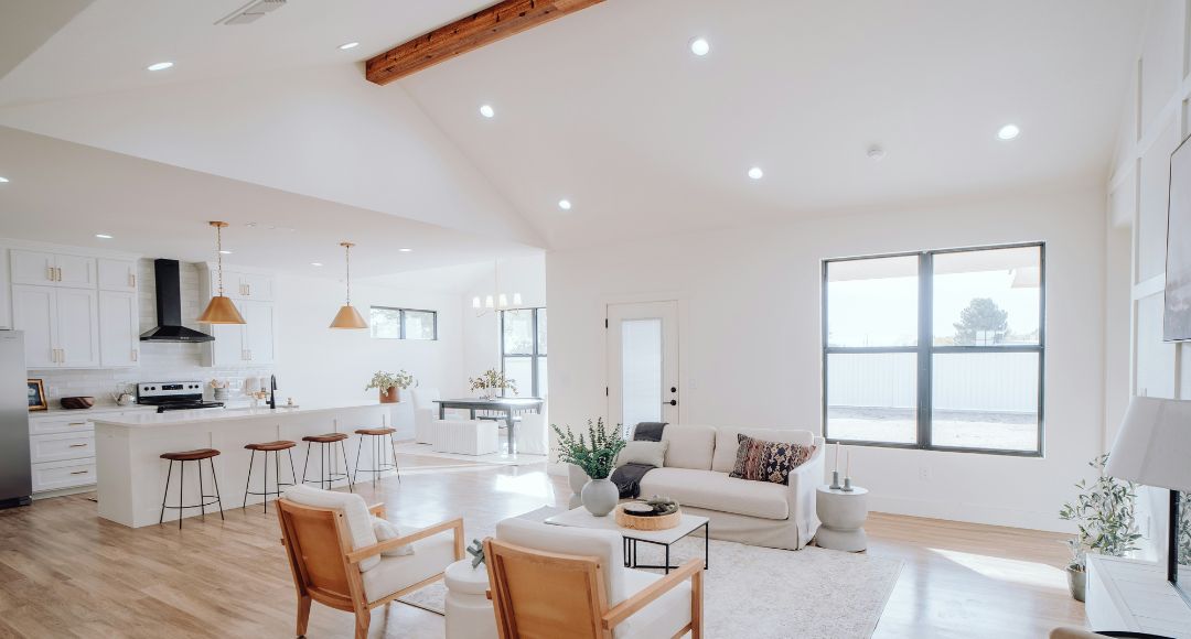 open concept with wood ceiling beams and LED downlights