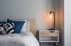 bedroom with warm white bedside table lamp