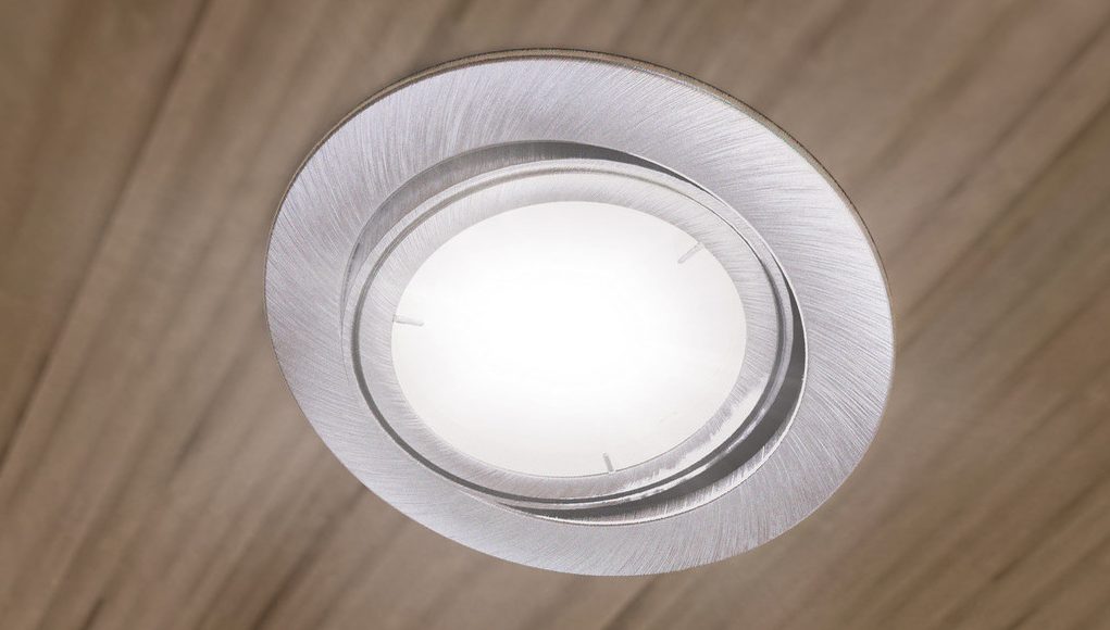 An LED downlight on a bedroom ceiling.