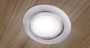 An LED downlight on a bedroom ceiling.