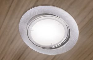 An LED downlight on a bedroom ceiling.