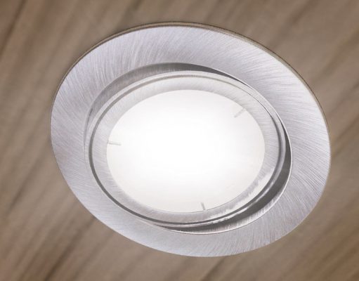 An LED downlight on a bedroom ceiling.