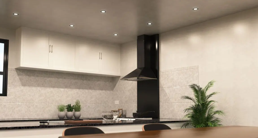 A kitchen and dining area illuminated by modern LED downlights.