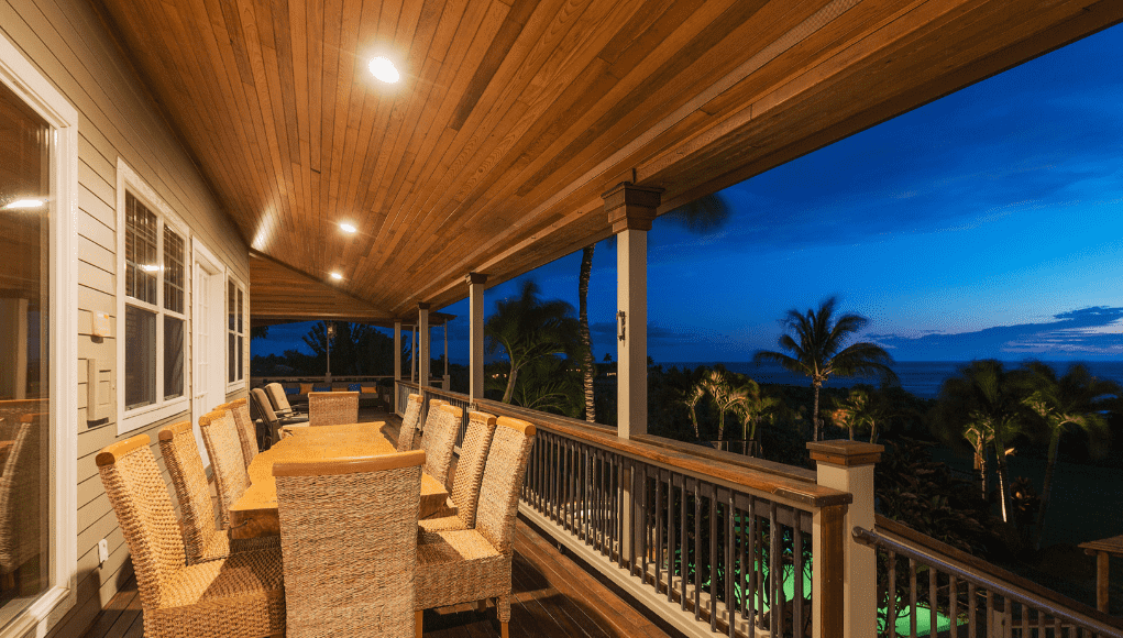 An elevated patio illuminated by LED downlights.